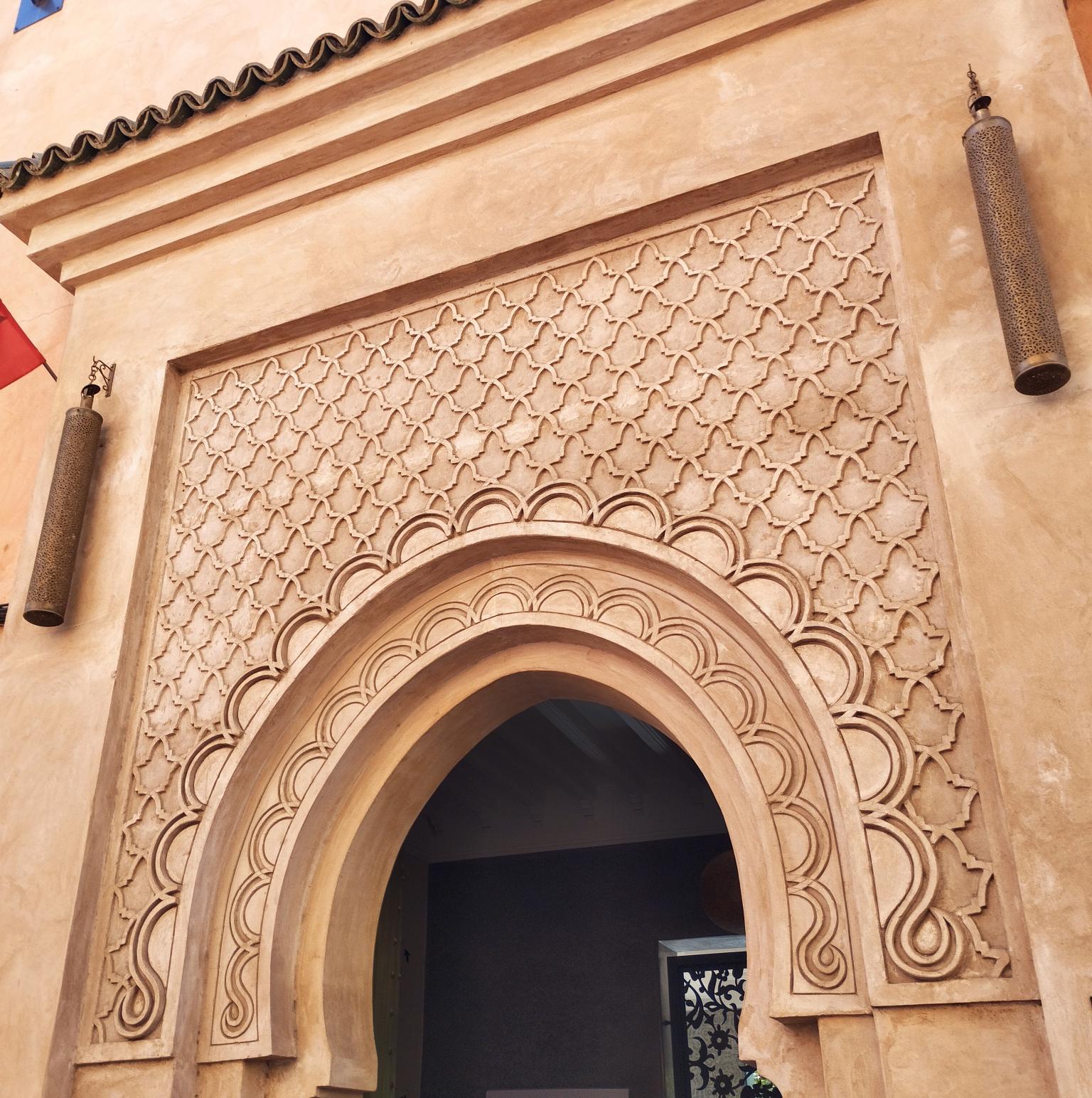 Carved archway and hanging lantern in Marrakech